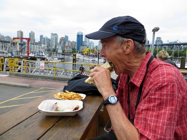 Marathon Mouth chomps down on salmon tacone at Go Fish, Vancouver B.C.