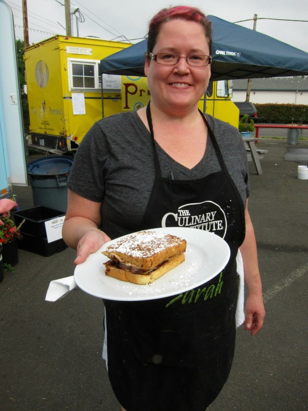 Sarah serves up an amazing egg/French toast concoction at her Egg Carton outlet