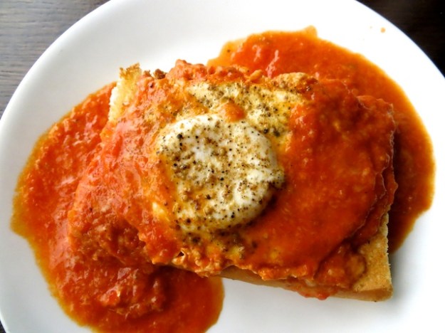 A lovely egg poached in tomato sauce at Caffe Mauro