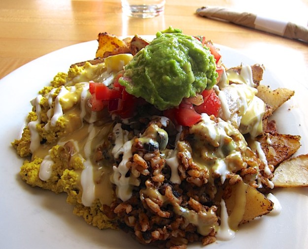 A colourful plate, featuring black beans and a tofu scramble, at Vertical Diner