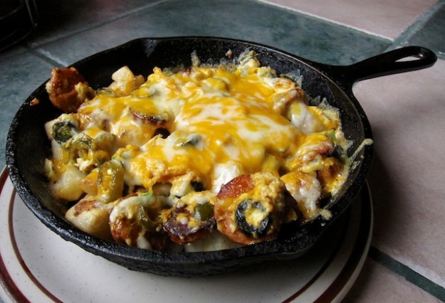 A Mexican scrambler served piping hot in a cast-iron frying pan