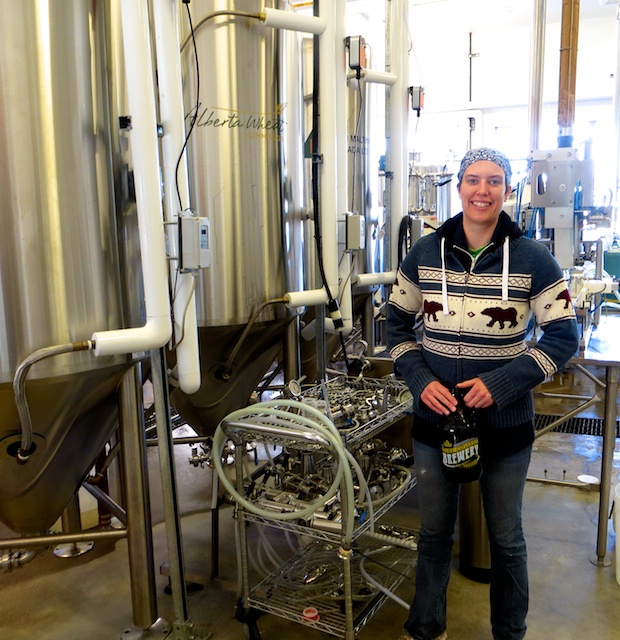 Lisa with all the gleaming new beer-making tanks at Olds College Brewery